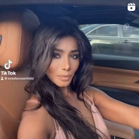 a woman in a car with long hair